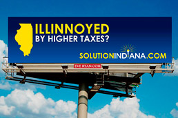 Billboard showing Indiana capitalizing on Illinois' tax increases to lure business to the state.