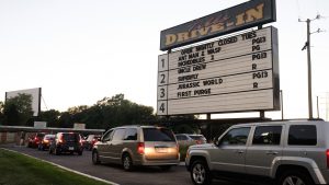 Cars line up long before sunset on Saturday nights to get into the west-side Tibbs Drive-In Theatre.