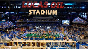 The Lego stadium includes players and fans.
