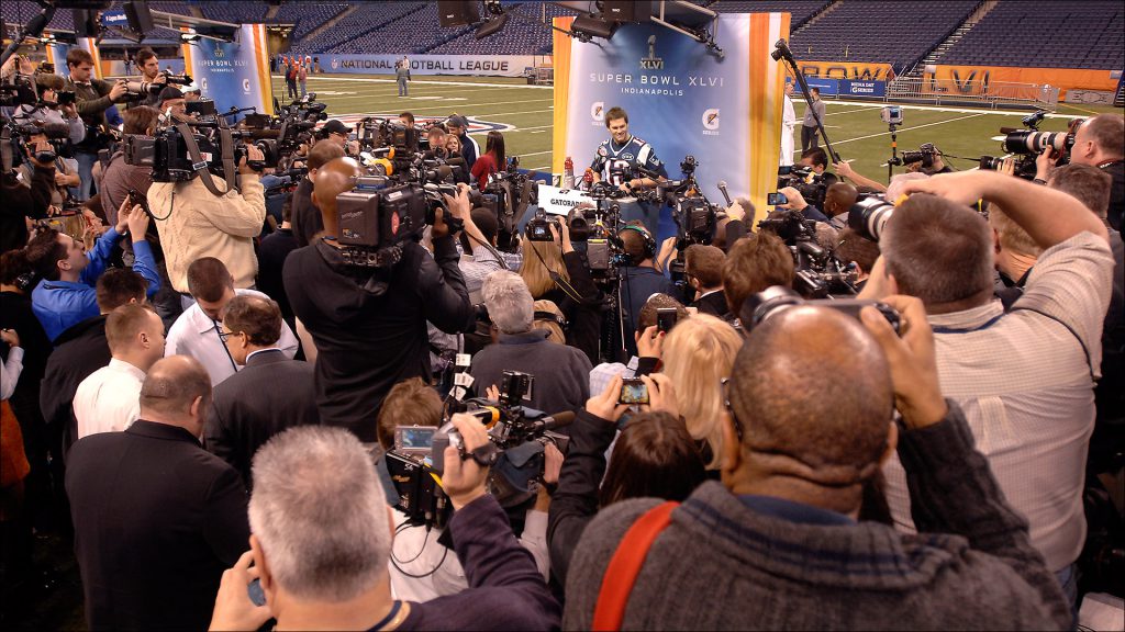 Players like Patriots quarterback Tom Brady addressed the throng at media day.